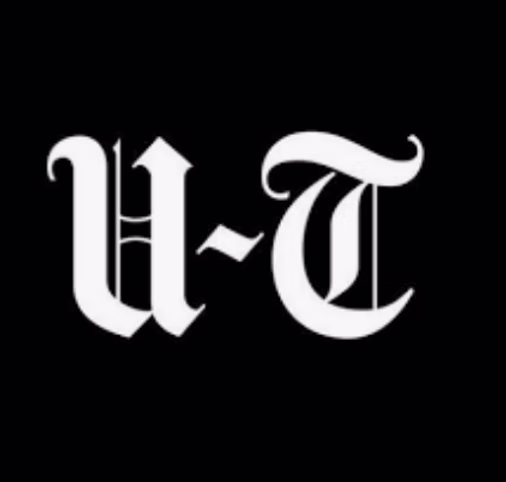 White Gothic-style letters "U-T" on a solid black background.