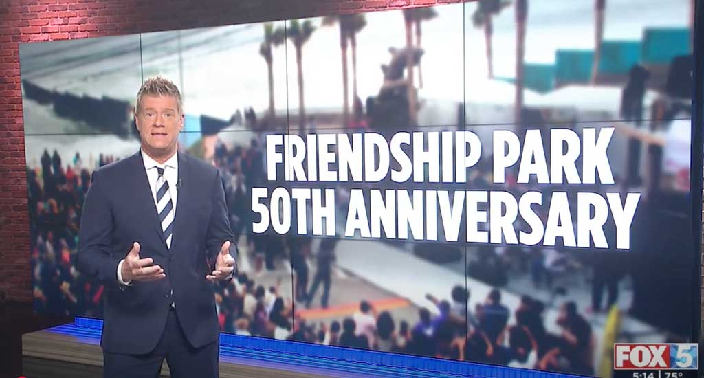 A news anchor stands in front of a screen displaying large text that reads "FRIENDSHIP PARK 50TH ANNIVERSARY," with a blurred image of a crowded outdoor event in the background. The FOX 5 logo appears in the bottom right.